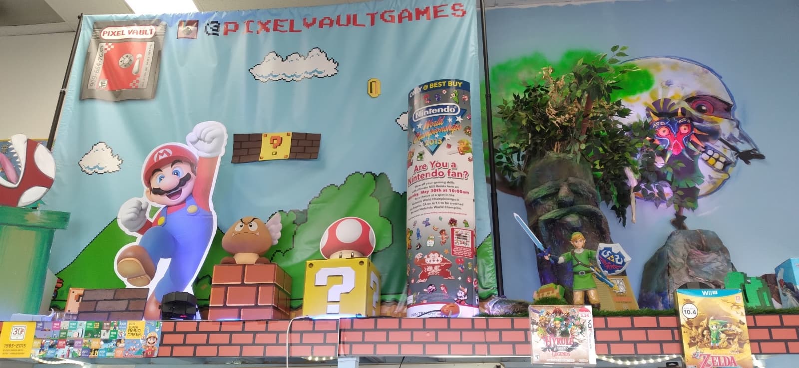 In-store display depicting scene with Mario, Link, and other video game characters